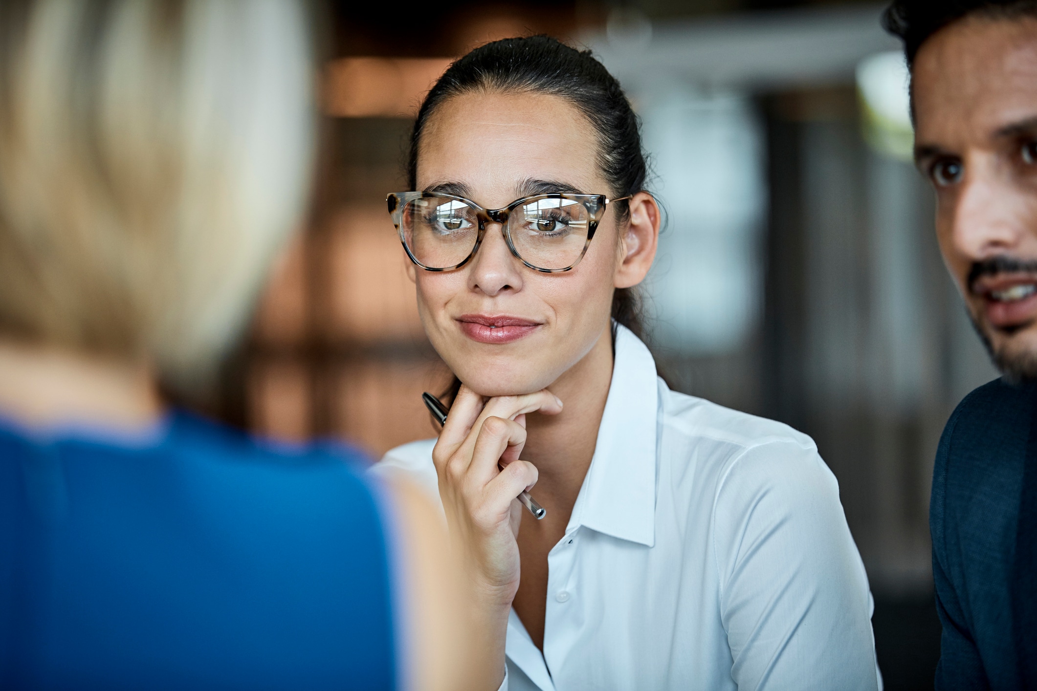 Woman with glasses on sitting next to man