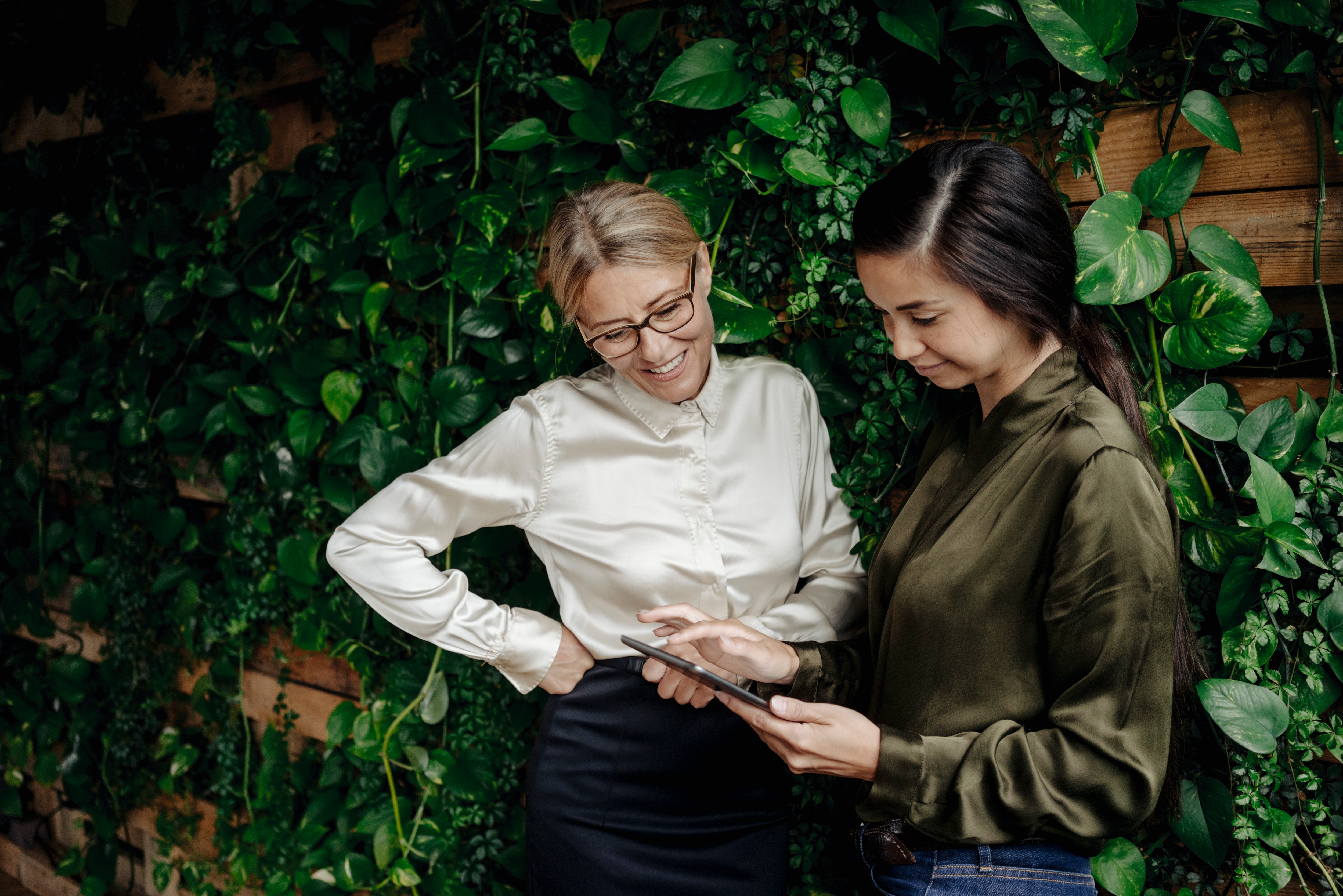 two women working, talking